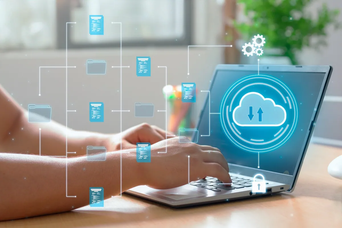 A laptop with a cloud connection illustration representing connected business tools